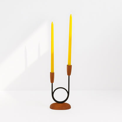 Candle holder with two beeswax 1/2" taper candles on a white background.